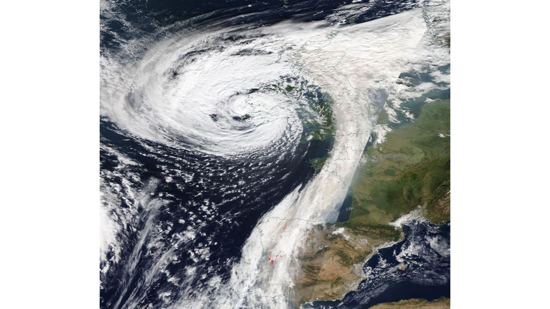 The tail of storm Ophelia is carrying smoke and dust north from southern Europe. The red dots show the locations of the wildfires in Portugal and Spain.