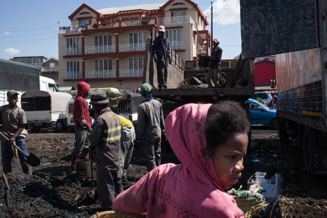 Council workers clear garbage during the clean-up of the market of Anosibe in Antananarivo. Rats are porters of fleas which spread the bubonic plague and are attracted by garbages and unsalubrity. 