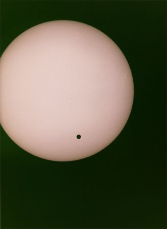 A photograph showing Venus as it passes between the Earth and the sun. This transit of Venus against the sun will not be visible again until 2117.