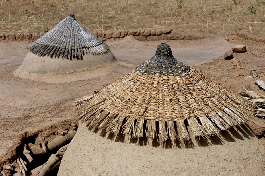 Overhanging roofs in the village of the Wenohian, Ghana, are made from local materials.