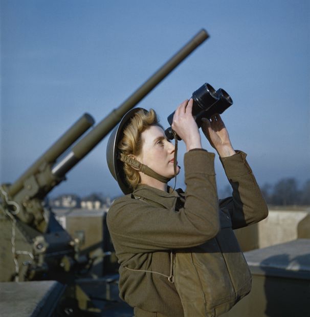 A 'spotter' at a 3.7-inch anti-aircraft gun site, in December 1942. Scroll through to see more images from the Imperial War Museums' collection of color World War II photographs, which are in their original condition, and are neither retouched nor colorized. 