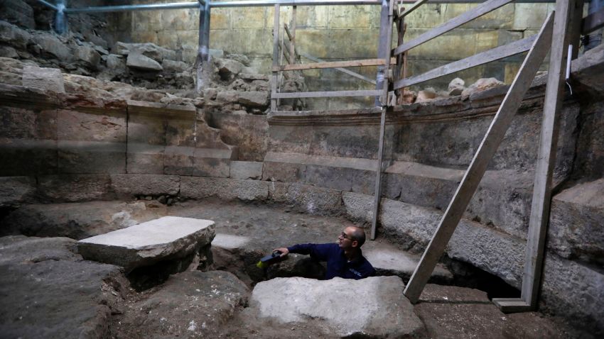 Joe Uziel, an archeologist from the Israeli Antiquity Authority, works on a recently discovered ancient roman theatre from the second sanctuary that was found at the foot of the Western Wall tunnels in Jerusalem's Old City on October 16, 2017. 
Excavations conducted by the Israel Antiquities Authority have uncovered large portions of the Western Wall that have been hidden for 1,700 years.  / AFP PHOTO / MENAHEM KAHANA        (Photo credit should read MENAHEM KAHANA/AFP/Getty Images)