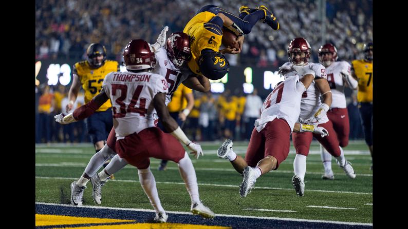 California Golden Bears quarterback Ross Bowers leaps for a touchdown against Washington State Cougars linebacker Justus Rogers during the second half at Memorial Stadium on Friday, October 13, in Berkeley, California. 
