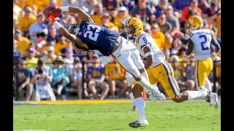 Auburn wide receiver Ryan Davis stretches for a catch against LSU safety Grant Delpit in the first half of an NCAA college football game on Saturday, October 14, in Baton Rouge, Louisiana. 
