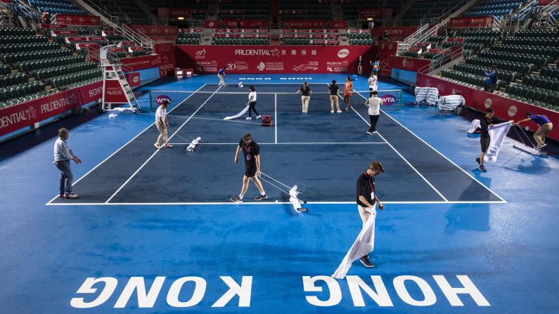 Workers and officials dry the court after heavy rain from Typhoon Khanun, which delayed the start of the women's singles final between Russia's Anastasia Pavlyuchenkova and Australia's Daria Gavrilova at the Hong Kong Open tennis tournament on Sunday, October 15. <a href="index.php?page=&url=http%3A%2F%2Fwww.cnn.com%2F2017%2F10%2F09%2Fsport%2Fgallery%2Fwhat-a-shot-sports-1010%2Findex.html" target="_blank">See 35 amazing sports photos from last week</a>