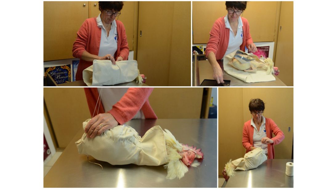 <strong>Preservation technique: </strong>Breeder Rachel Roussel-Voisard performs the "roulage" which involves dressing the bird in a white cloth after is slaughtered.