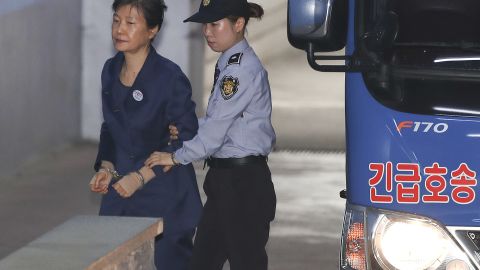 Former South Korean President Park Geun-hye, left, arrives for her trial at the Seoul Central District Court on Monday.