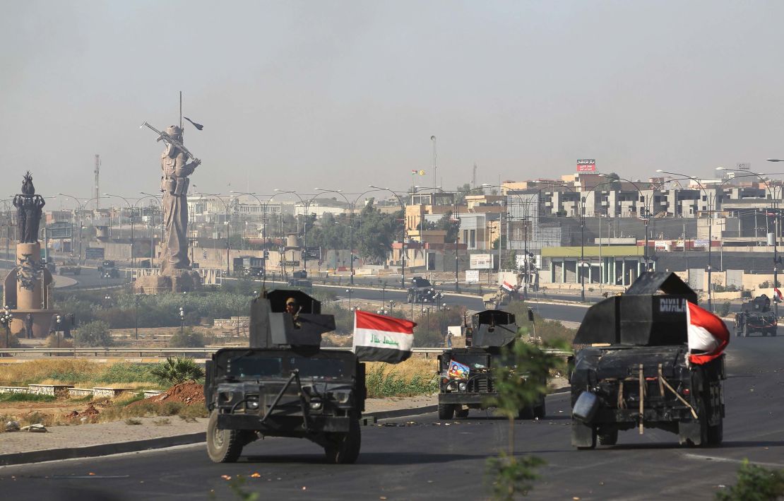 Iraqi forces advance to the center of Kirkuk during the operation against Kurdish fighters.