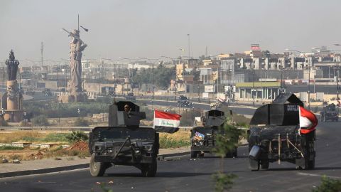 Iraqi forces advance to the center of Kirkuk during the operation against Kurdish fighters.