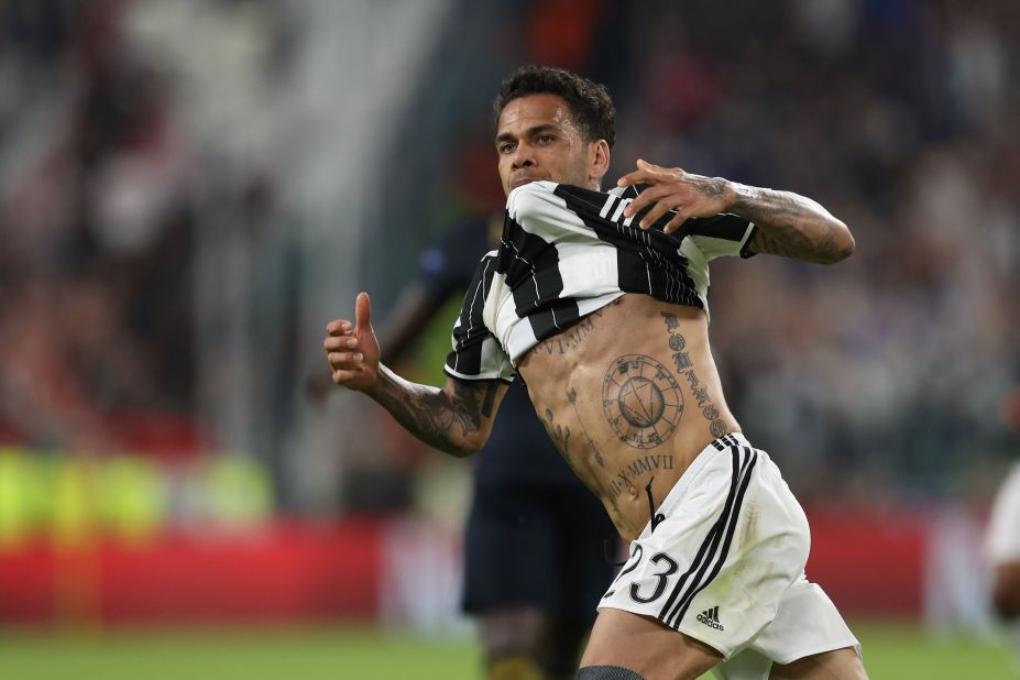 PSG defender Dani Alves is one of football's characters. The former Barca star's arms are adorned with Catholic images and dedications to his family, while across his chest is his son's name in giant script. 