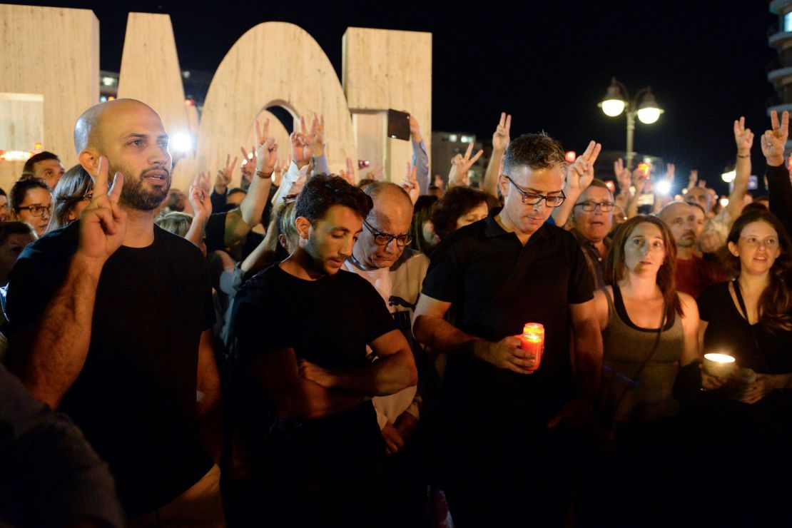 Thousands of people gather for a candlelight vigil in Sliema in tribute to Caruana Galizia on Monday.