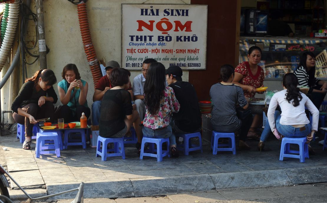 Sit down for papaya salad with beef in Hanoi's Old Quarter.