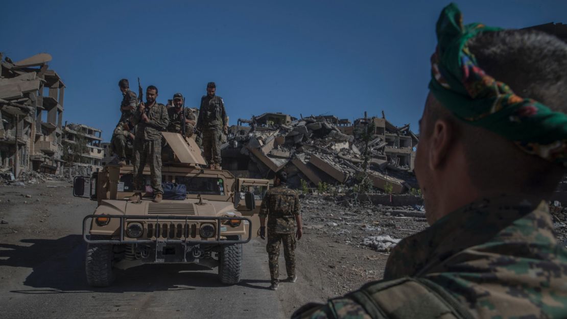 Soldiers of SDF on the top of a humvee during celebration of the liberation of Raqqah.
West Raqqah October 17, 2017