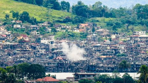 Smoke billows from destroyed buildings after troops fired mortars at ISIS position in Marawi, October 15, 2017.