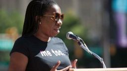 Tarana Burke, wearing a 'me too' T-shirt,  addresses the March to End Rape Culture in Philadelphia in 2014.