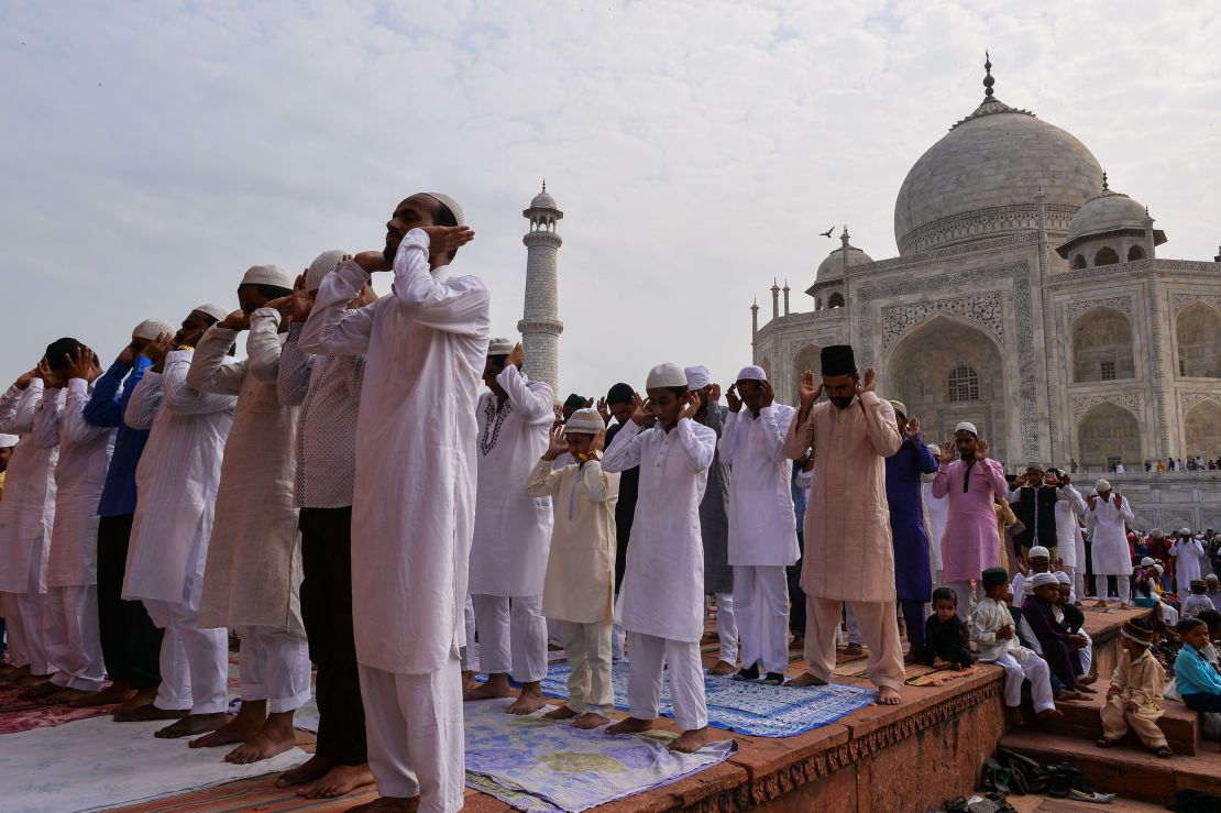 Muslims pray during the Eid al-Adha festival at the mosque inside the Taj Mahal in Agra on September 13, 2016. 

