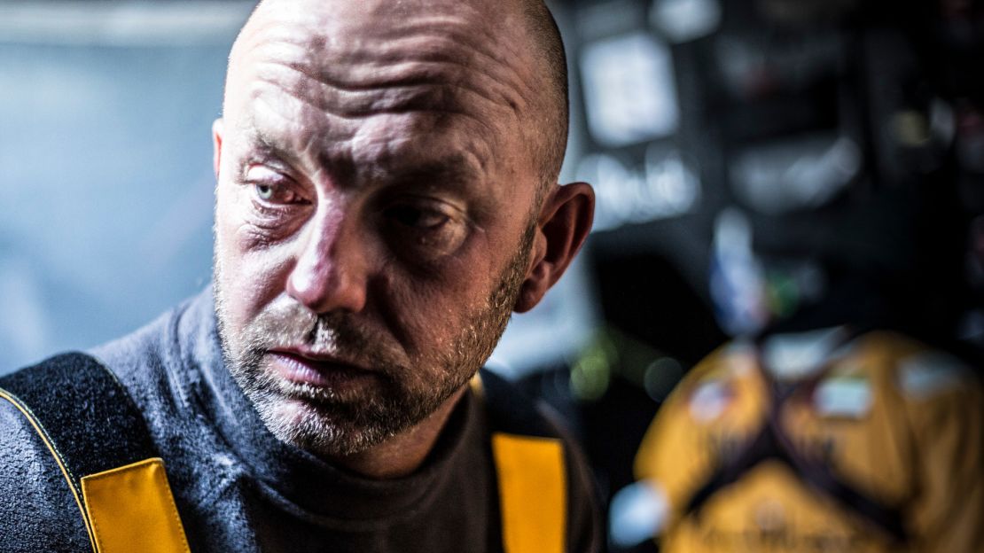 Ian Walker sighs as he is about to put on wet weather gear for another watch on deck during the 2015 race.