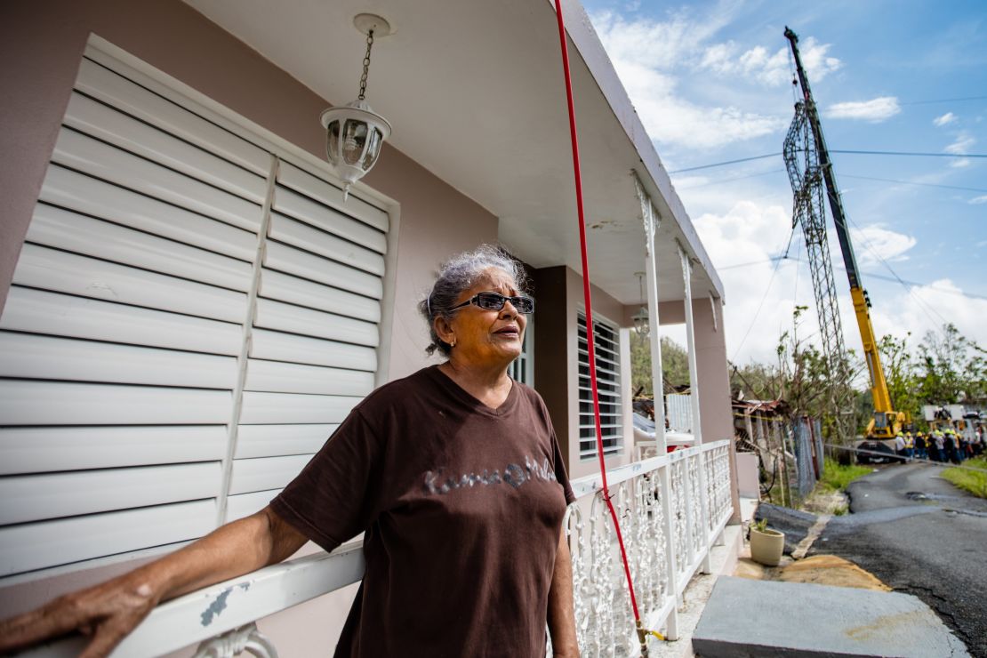 This was a day of hope for Diana Aponte, standing outside her home in Aguas Buenas, next to the reconstruction of a transmission tower.