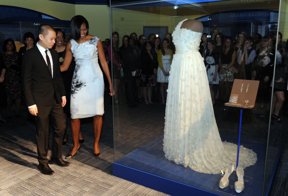 Obama and designer Jason Wu look at a display of her inaugural gown at the Smithsonian's National Museum of American History.