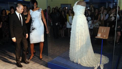 Obama and designer Jason Wu look at a display of her inaugural gown at the Smithsonian's National Museum of American History.