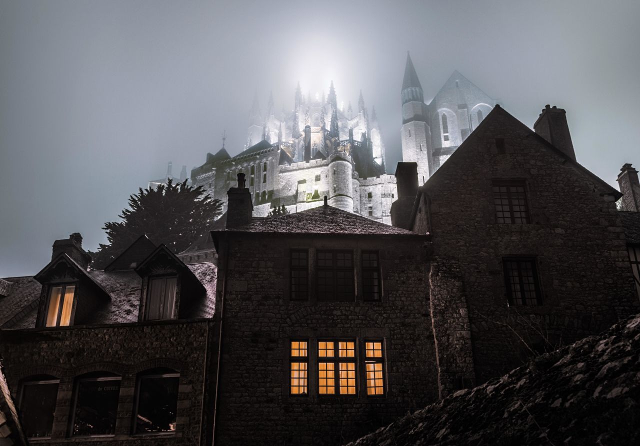 The 14th century Mont Saint Michel on a misty night.