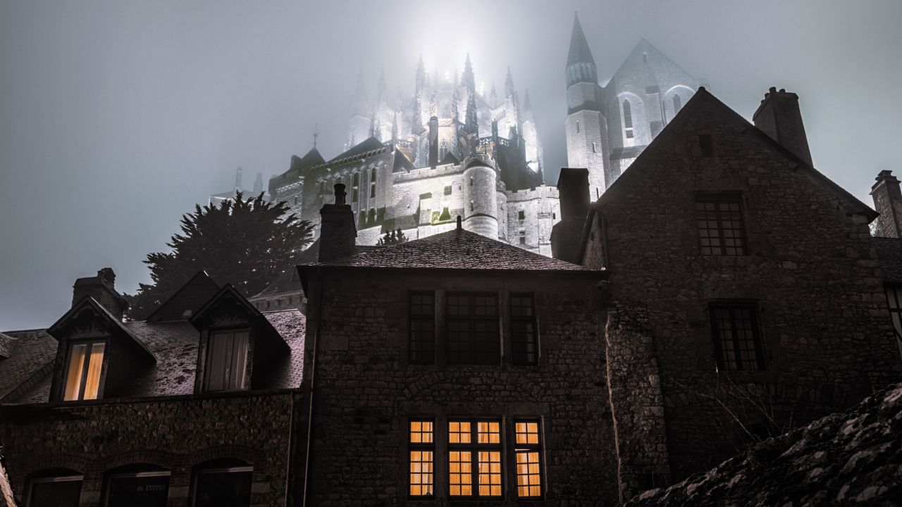 The 14th century Mont Saint Michel on a misty night.