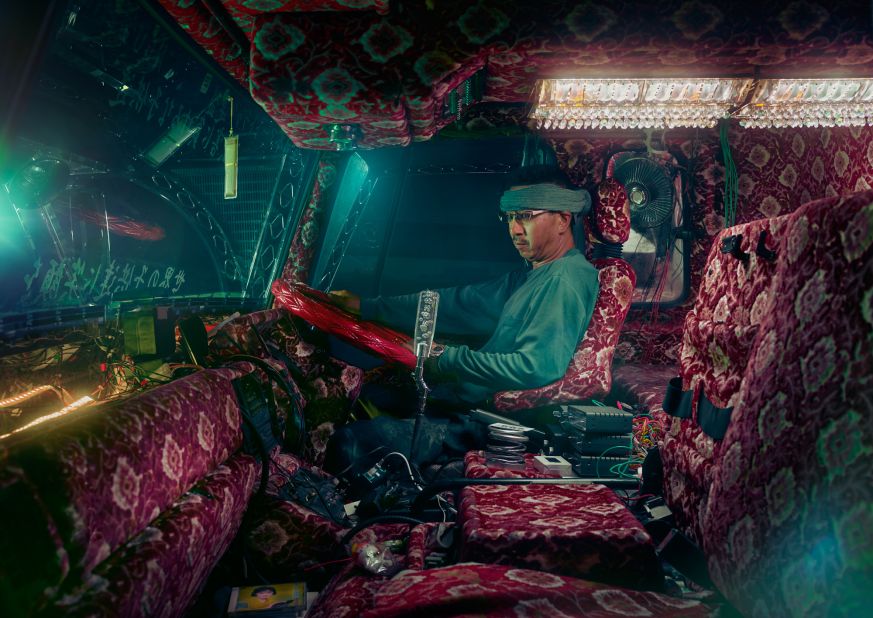 Inspired by series of movies called "Torakku Yaro," the drivers adorn their trucks with gaudy decorations, using flourishes such as LED lights and patterned fabric.<br />