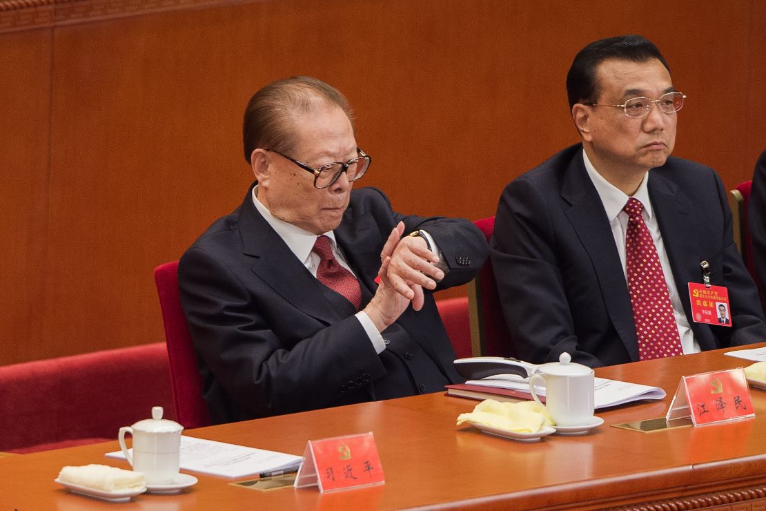 Former president Jiang Zemin was spotted looking at his watch during Xi's speech, which lasted more than three hours. 
 