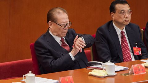 Former president Jiang Zemin was spotted looking at his watch during Xi's speech, which lasted more than three hours.
