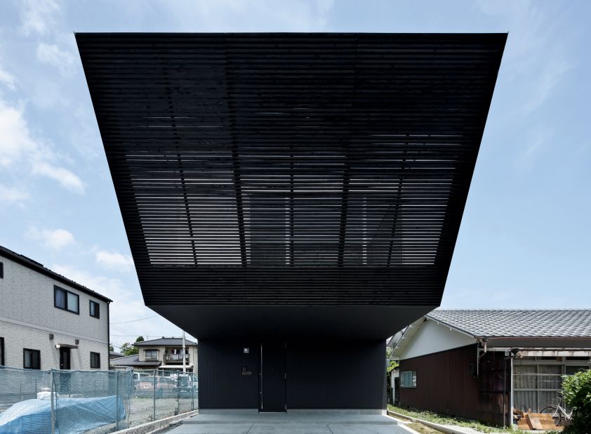 A family of five live in this build in Japan. Although the exterior is entirely black, the interior is the polar opposite and offers stark white surroundings. 