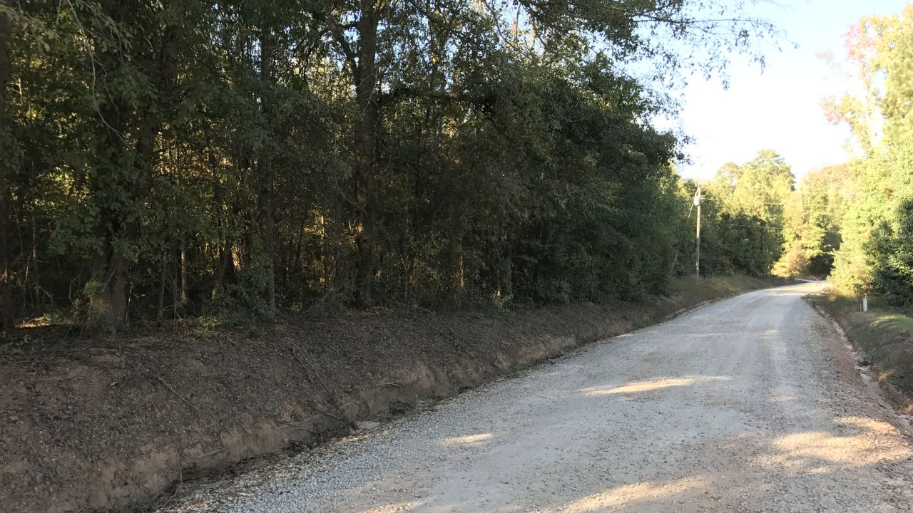 Coggins' body was found in a field off this gravel road in Sunny Side, news reports from the time say.
