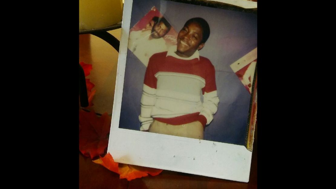 The Teddy Pendergrass album, "Teddy," serves as a backdrop in this family Polaroid of Timothy Coggins.