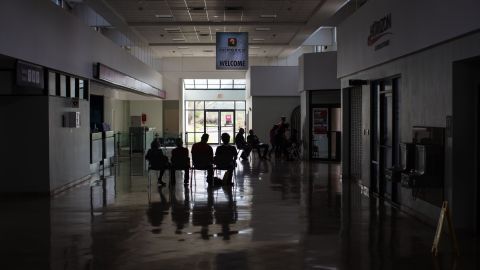 Veterans take a break from their relief work in the old arrivals area of the Mayaguez airport.