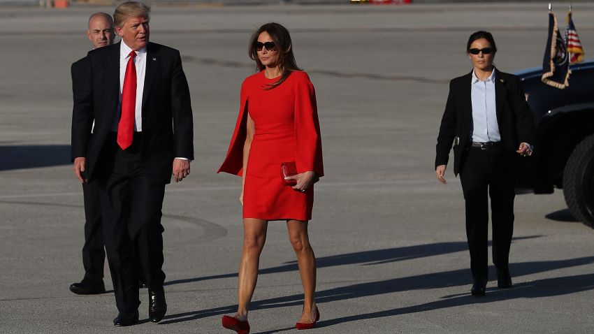 PALM BEACH, FL:  U.S. President Donald Trump  walks with his wife Melania Trump on the tarmac after he arrived on Air Force One at the Palm Beach International Airport for a visit to his Mar-a-Lago Resort for the weekend on February 3, 2017 in Palm Beach, Florida. (Joe Raedle/Getty Images)