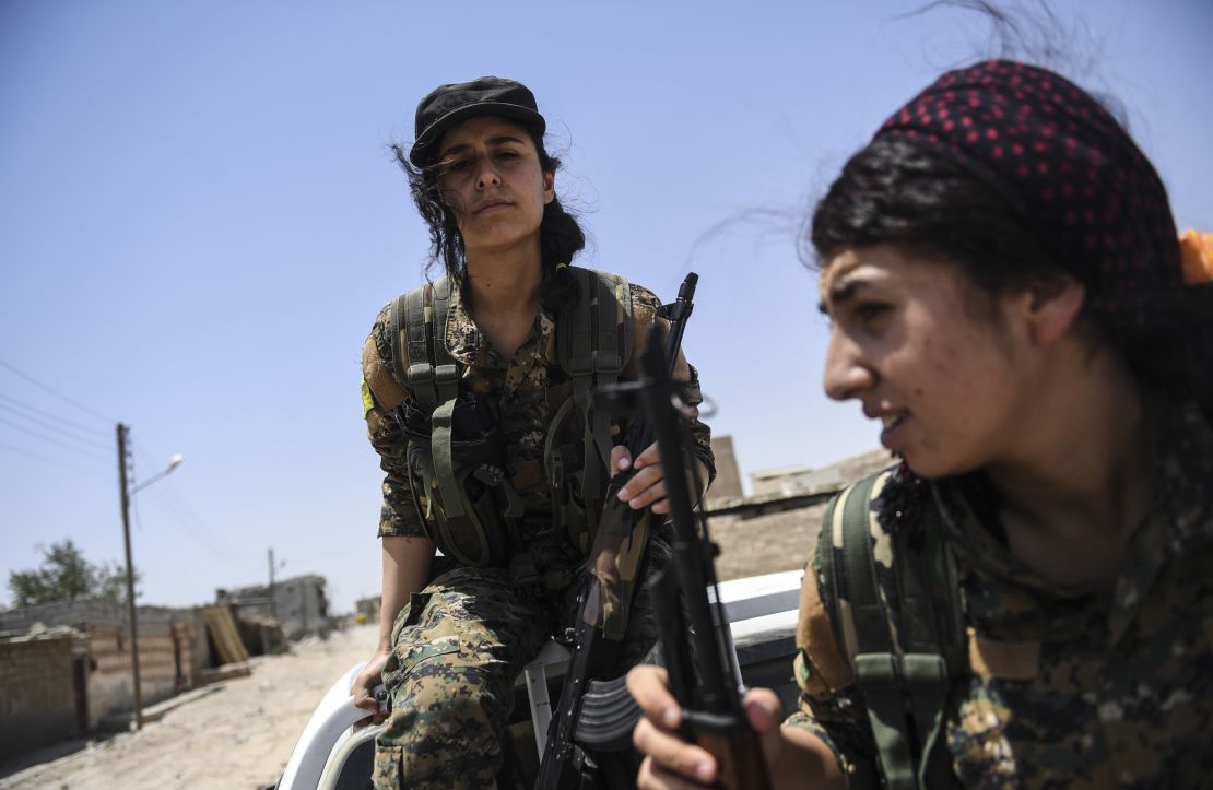 Female Kurdish fighters on the outskirts of Raqqa in July.