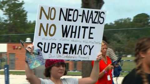 Protesters held up signs against Richard Spencer in Gainesville.