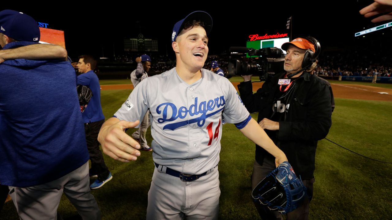 Los Angeles Dodgers' Enrique Hernandez celebrates with his teammates celebrate after Game 5 of baseball's National League Championship Series against the Chicago Cubs, Thursday, Oct. 19, 2017, in Chicago. The Dodgers won 11-1 to win the series and advance to the World Series.