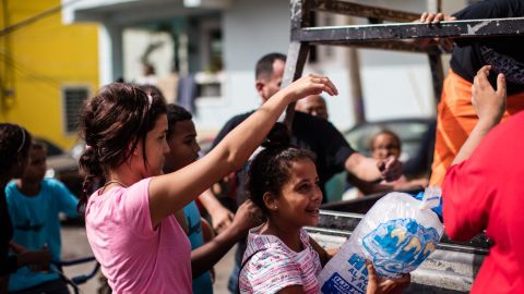Without power for freezers, residents of La Perla still rely on ice deliveries.