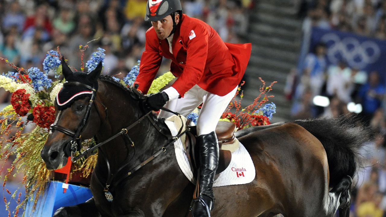 Eric Lamaze of Canada rides with "Hickstead" in the equestrian jumping individual competition in Hong Kong on August 21, 2008 during the 2008 Beijing Olympic Games.       AFP PHOTO / DDP / DAVID HECKER  (Photo credit should read DAVID HECKER/AFP/Getty Images)
