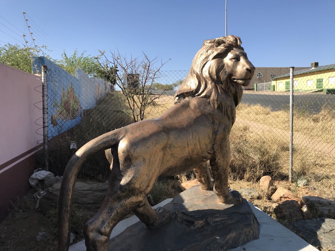 A statue of a lion outside the warehouse in Namibia.