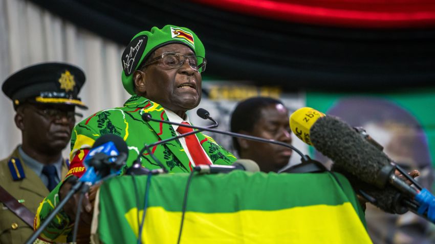Zimbabwe's President Robert Mugabe delivers a speech during a meeting of his party's youth league where he hinted at a cabinet reshuffle, on October 7, 2017, in Harare.
Robert Mugabe warned some ministers will be axed in a shake-up of his cabinet amid deepening infighting in his Zanu-PF party over who succeeds him. Mugabe's announcement came amid escalating tension between rival factions jostling to succeed the 93-year-old -- including his lieutenants and his wife. / AFP PHOTO / Jekesai NJIKIZANA        (Photo credit should read JEKESAI NJIKIZANA/AFP/Getty Images)