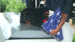 Sgt. La David Johnson's widow kisses his casket before it's buried in the Hollywood Memorial Gardens on October 21, 2017.
