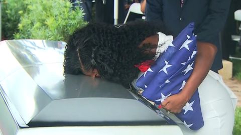 Sgt. La David Johnson's widow, Myeshia, kisses his casket before his burial Saturday.