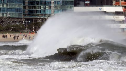 Enormous waves crash onto the coast of Busan, South Korea, on Sunday. Fishing boats were forbidden from going out to sea. 