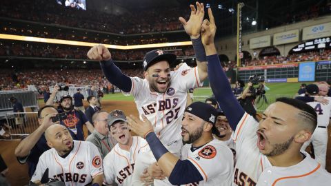 Houston's Jose Altuve is lifted by teammates after the Astros beat the New York Yankees in Game 7.