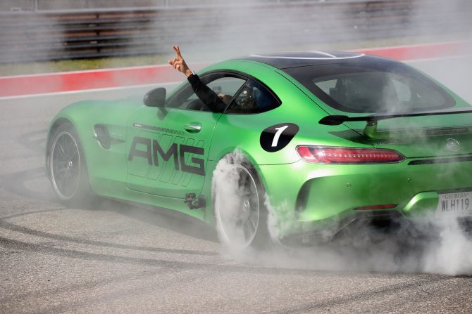 ... doing donuts on the track before Sunday's drivers' parade.