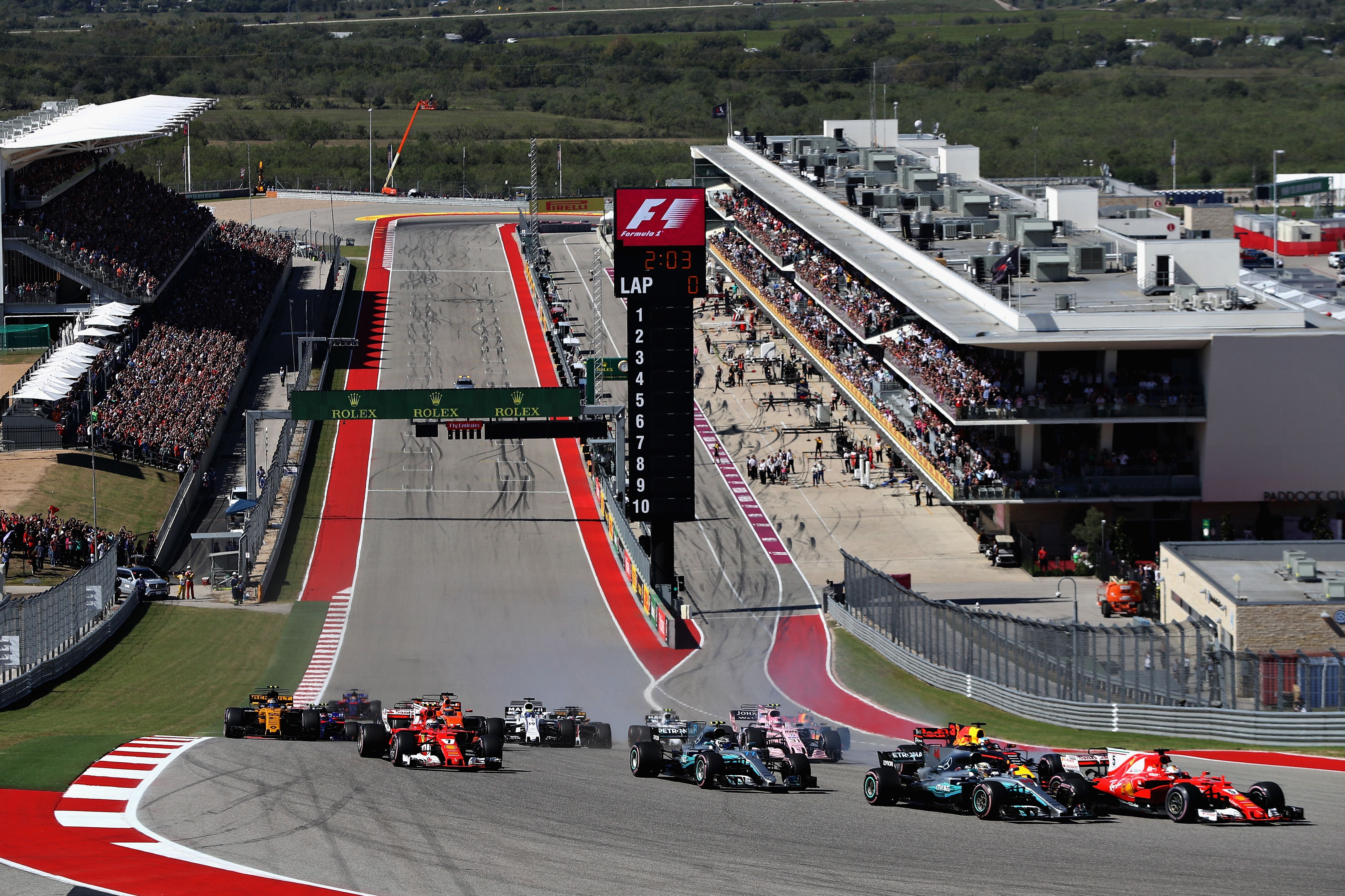 Sebastian Vettel (far right) leads into the first corner at the start of the 2017 United States Grand Prix. 