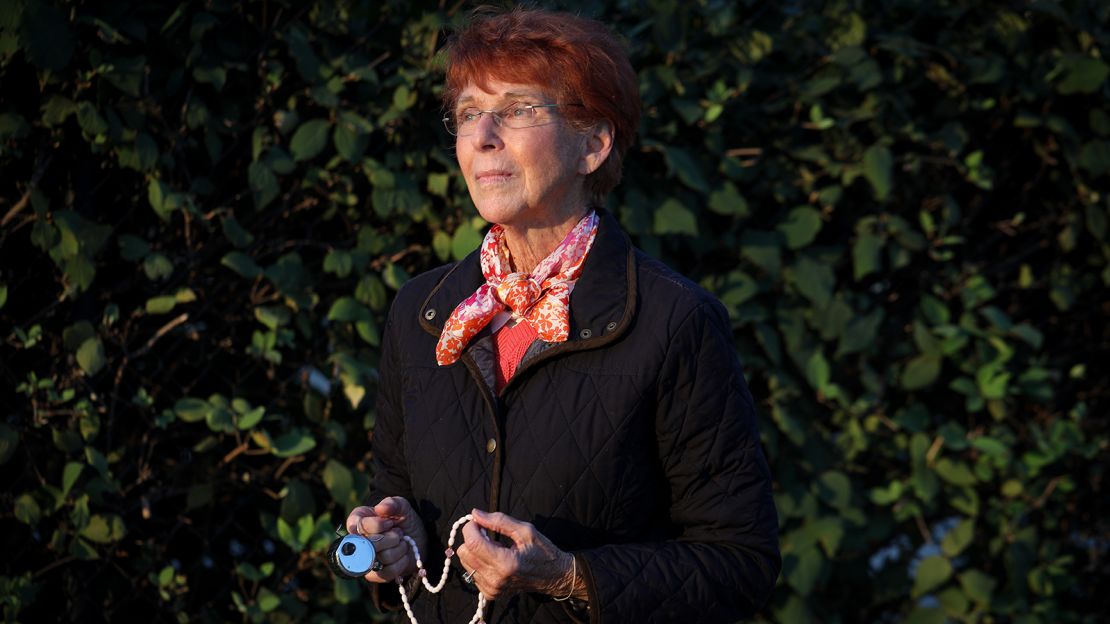 Donna Durning holds a rosary and a counter to count the number of women who walk into the clinic.