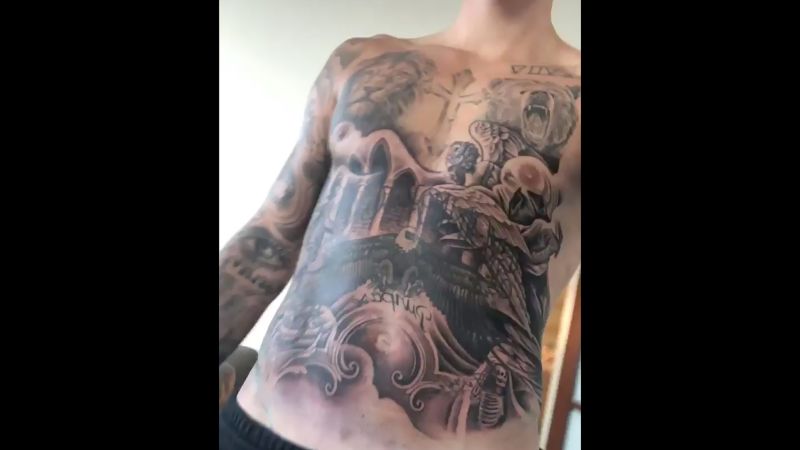 Justin Biebers Indian Head Hockey Team Logo Tattoo on His Back  Shoulder  PopStarTats