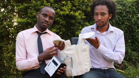 Makerere University graduates Brian Turyabagye and Besufekad Shifferaw showing off the biomedical smart jacket.
